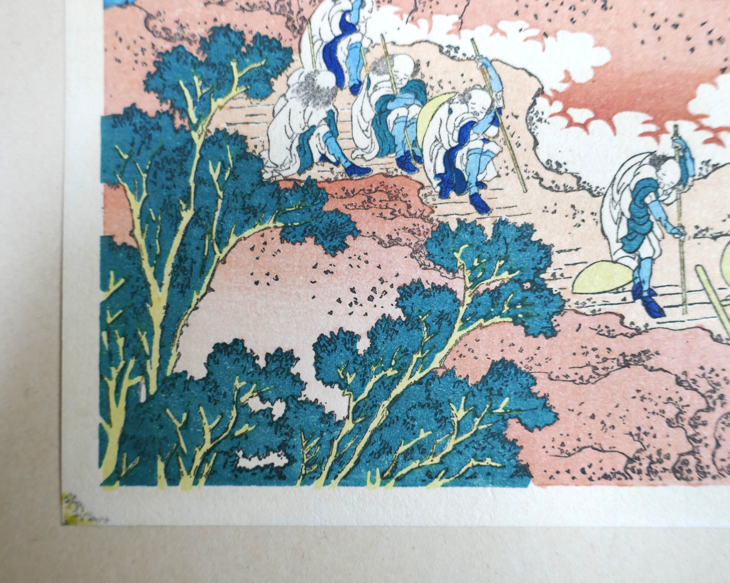 Détail coin bas gauche, feuillages et rochers de l’estampe Shojin Tozan de Hokusai