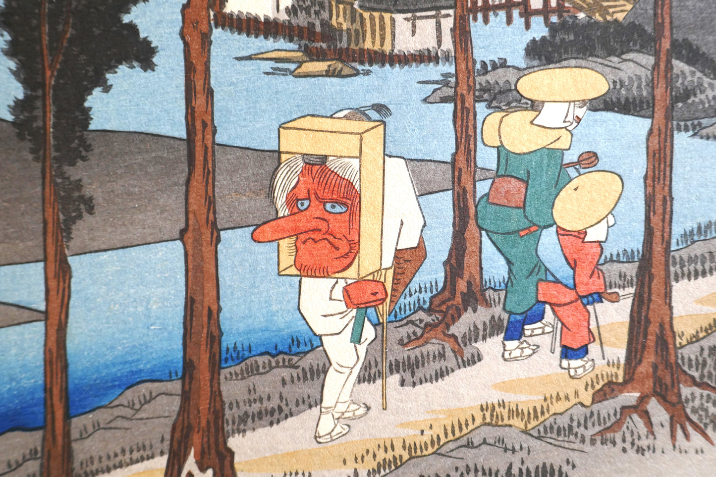 Zoom sur le personnage au masque Tengu dans l'estampe Numazu, série des 53 stations du Tokaido par Hiroshige, édition Taishō.