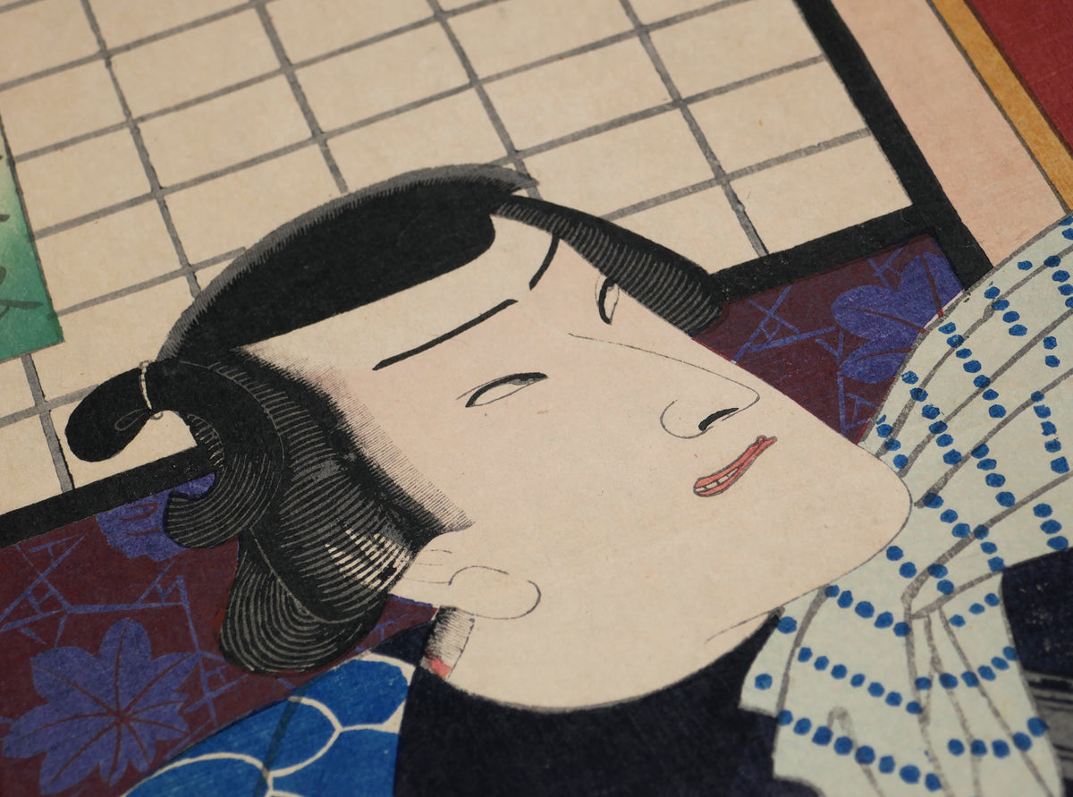 Gros plan du visage et de la coiffure traditionnelle d'un acteur de kabuki dans une gravure japonaise ancienne.
