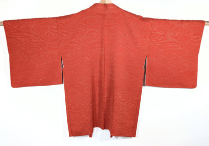 Dos d’un haori japonais vintage orange en soie, motif d’eau en tourbillons sur veste kimono traditionnelle
