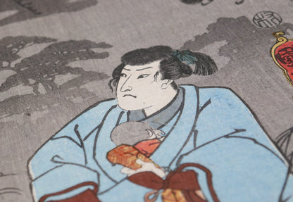 Vue rasante du rōnin et de l’enfant révélant le papier japonais et l’impression polychrome nishiki-e de Kuniyoshi.