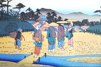 Groupe de personnages au carrefour de Kusatsu sur estampe de Hiroshige, route du Kisokaidō