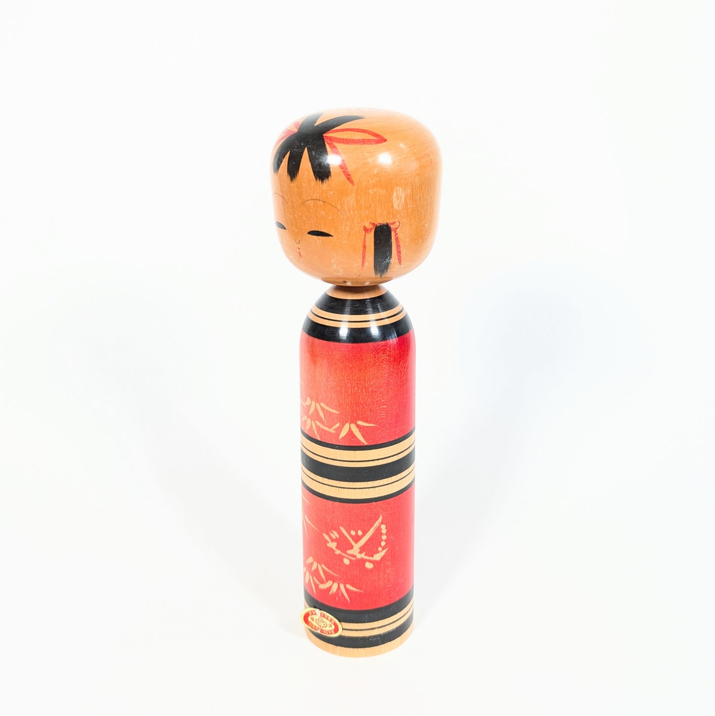 Poupée japonaise en bois kokeshi sosaku rouge avec motifs de bambou peints à la main