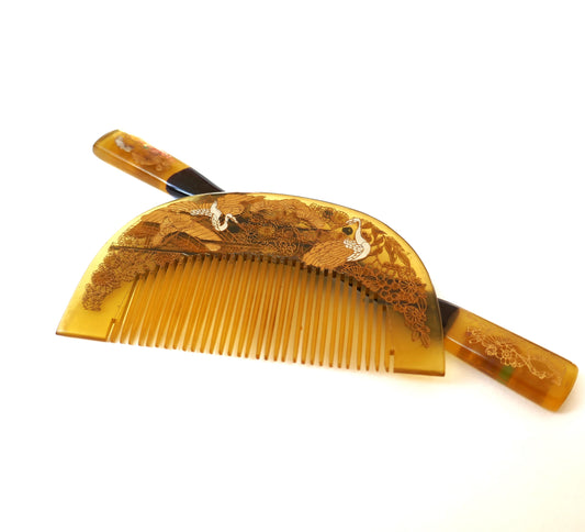 Parure japonaise kushi et kogai en imitation bekko, décor maki-e doré représentant des grues et fleurs, époque Shōwa.