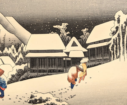 Voyageurs marchant sur la route du Tōkaidō en hiver à Kanbara, scène de neige nocturne par Hiroshige